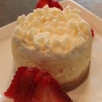 Cheesecake · Our homemade cheesecake has a hint of lemon with rich whipped cream and buttery crust.