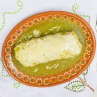 Burrito Mojado (Wet Burrito) · Includes rice, whole beans, cheese, lettuce, tomato, salsa, sour cream, guacamole, and dippe...