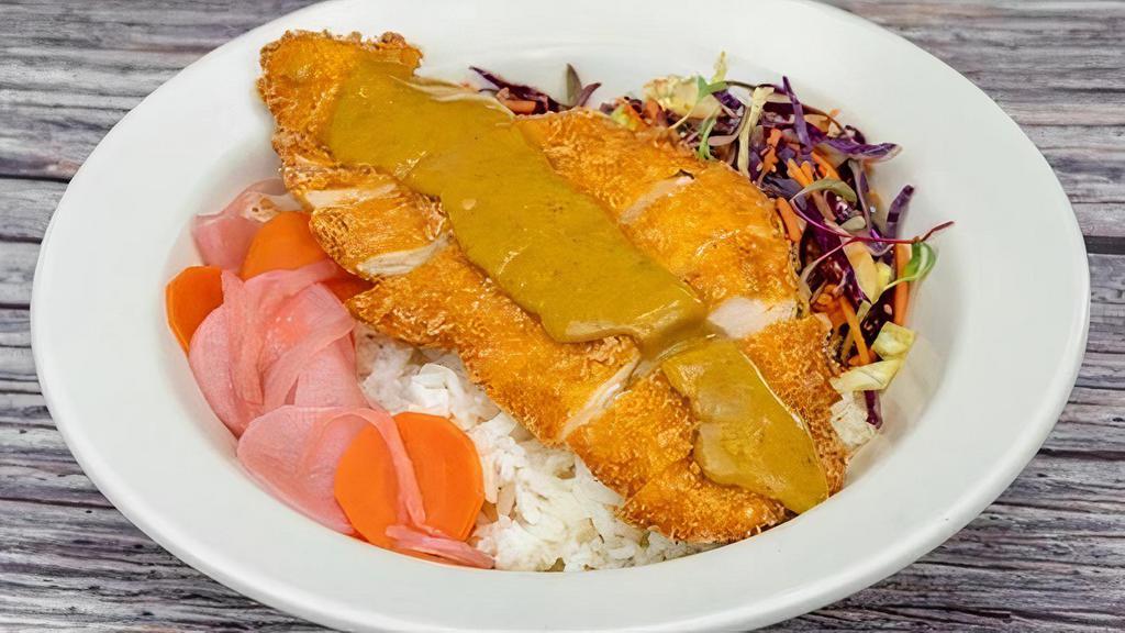 Chicken Katsu Curry Bowl · Chicken breast breaded with our house spice blend and panko then fried to perfection. Served over chicken rice with sesame slaw, fukujinzuke, and our house-made curry sauce.