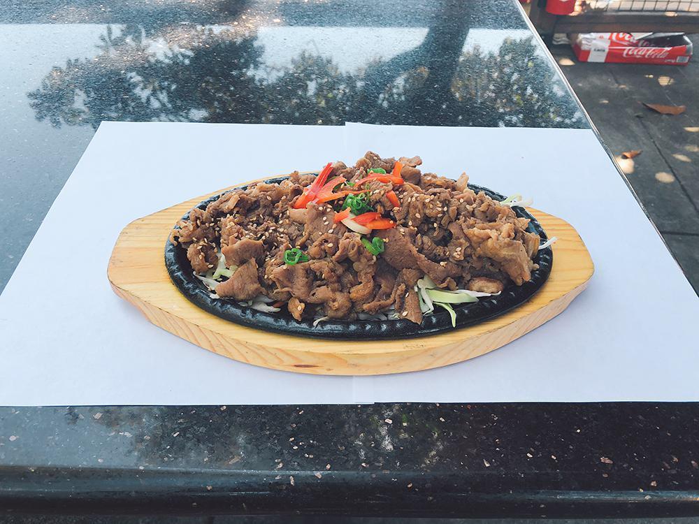 Thinly Sliced Beef (불고기) · Rib-eye marinated in soy sauce.