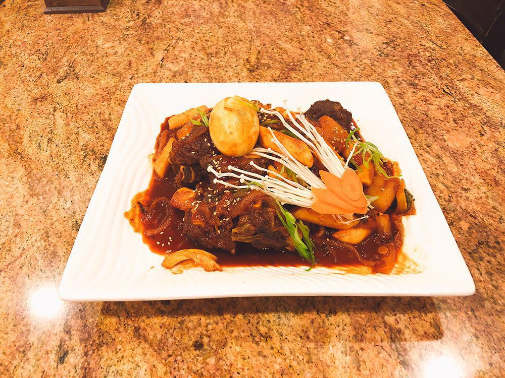 Braised Beef Short Ribs (갈비찜) · Braised short ribs, carrots, and potatoes in our marinade sauce. Available spicy or non-spicy.