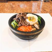 Hot Stone Bowl Bibimbop (돌솥비빔밥) · A bed of bean sprouts, spinach, mushroom, zucchini and julienned carrots served over rice an...
