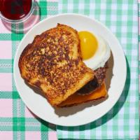 Le Sausage, Egg, and Cheese French Toast Sandwich · So good, it’ll have you wondering why the Eiffel Tower isn’t made out of sausage links. Saus...