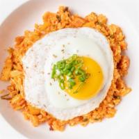 23. Kimchi Fried Rice · Kimchi fried rice with choice of beef or spam and fried egg.