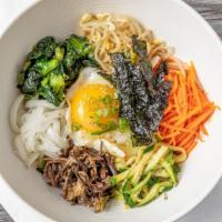 21. Bibimbap · Fresh vegetables, beef and fried egg over rice.
