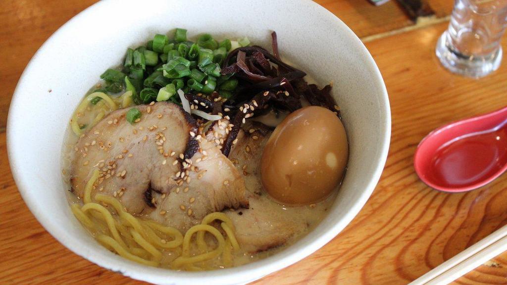 Tonkotsu Ramen(Pork) · Waraku’s signature pork broth ramen with slow-braised pork belly (chashu), seasoned soft boiled egg, bean sprouts, green onion, and kikurage mushrooms.