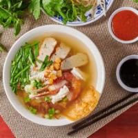 32. Hu Tieu Do Bien (Seafood) · Rice noodle with jumbo prawn, crab claw, squid, fried fish cake.