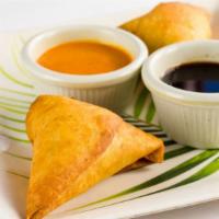 Potli Samosa (2 Pcs) · Vegetarian turnovers stuffed with potatoes, peas, spices, herbs, and served with mint and ta...