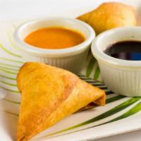 Chicken Samosa(2 Pcs) · Triangle pastries stuffed with mildly spice, minced chicken. Fried and served with mint and ...