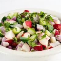 Kachumber Salad · Onions, tomatoes and cucumber salad sprinkled with spices and lemon juice.