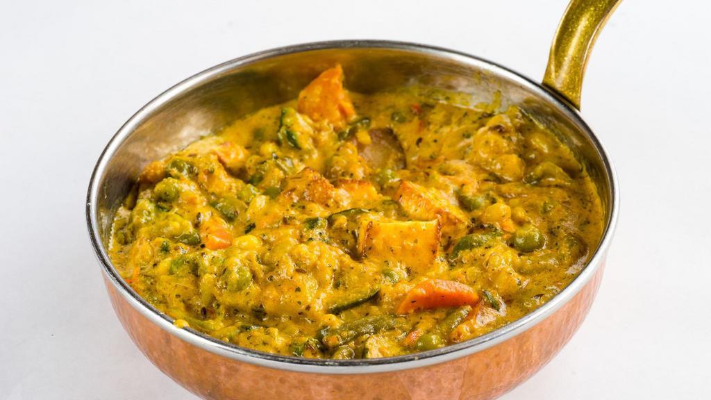 Chicken Korma · Boneless chicken in rich, creamy curry cooked with saffron, cinnamon, green cardamom, and almond paste.