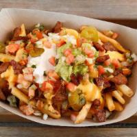 Vegan Sisig Fries · Choice of protein with french fries topped with nacho cheese, sour cream, guacamole, pico de...
