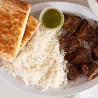 Beef Kabob · Marinated tender beef served with basmati rice and fresh Mediterranean tossed salad.