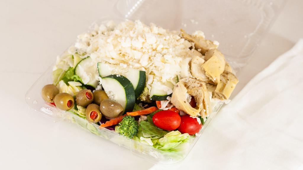 Greek Salad · Lettuce, tomatoes, cheese, artichoke hearts, olives, cucumbers, broccoli, celery, and feta cheese.
