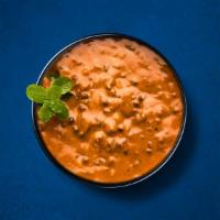 Divine Black Lentils · Black lentils slow-cooked, tempered with Indian whole spices, and finished with fresh corian...