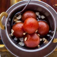 Gulab Jamun · Sweet pastry ball in syrup.