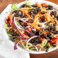 Greek Salad · Onions, tomatoes, olives, feta cheese, cucumbers, carrots.