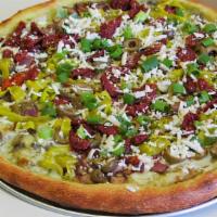 Greek Style Pizza · Mushrooms, red onions, sun dried tomatoes, pesto sauce, pepperoncini, green olives, feta che...