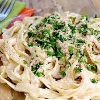 Fettuccine Alfredo · Traditional cream sauce. Served with garlic bread and side salad.