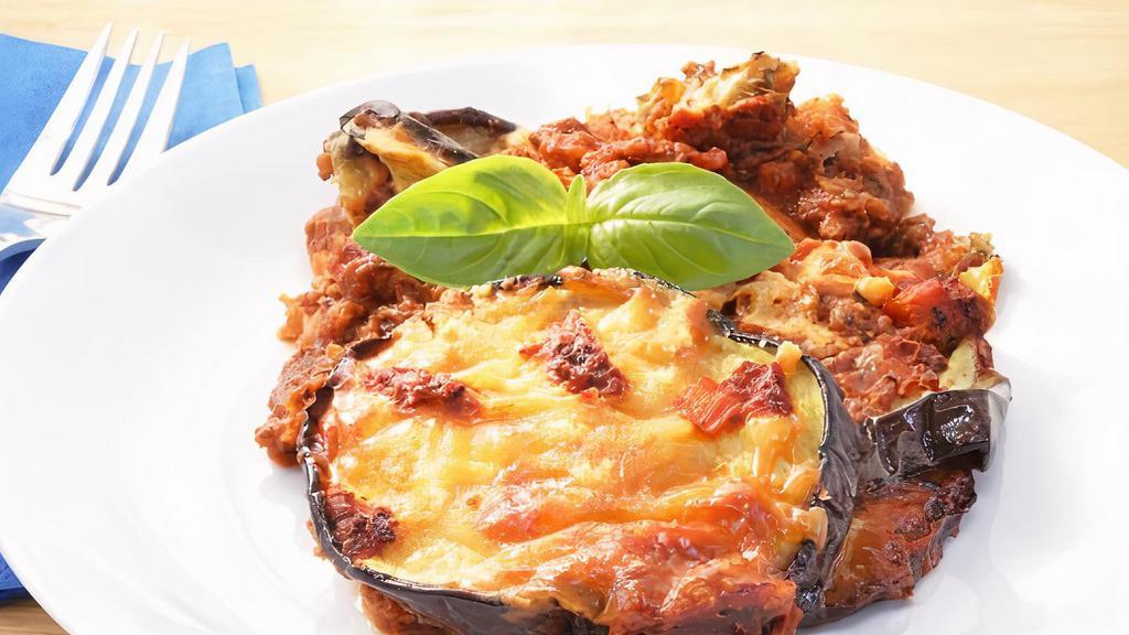 Eggplant Parmigiana Pasta · Layers of fresh eggplant baked with marinara sauce and topped with mozzarella cheese. Served with french bread and butter.