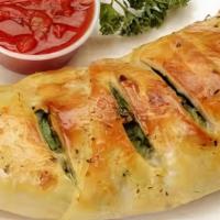 Vegetarian Special Calzone · Mushrooms, onions, bell peppers, sliced tomatoes, mozzarella cheese and ricotta cheese, blac...