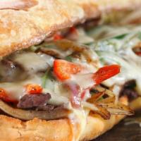 Philly Steak Sandwich · Onions and bell peppers. Served on a french roll.