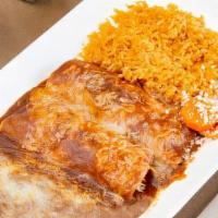 Enchiladas · Rolled corn tortilla filled with your choice of meat. Topped with red enchilada sauce and ch...