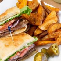 Torta Carne Asada · Sirloin steak sandwich. Served on a Mexican roll with mayonnaise, onions, tomatoes, jalapeno...