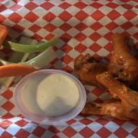 Chicken Wings · House Made deep fried Chicken Wings tossed with  your choice of sauce.