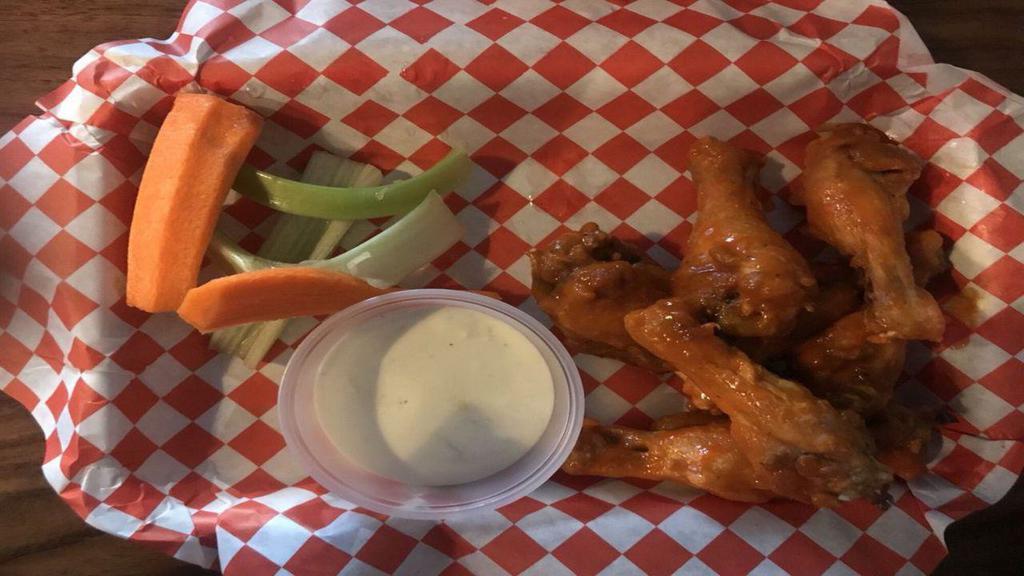 Chicken Wings · House Made deep fried Chicken Wings tossed with  your choice of sauce.
