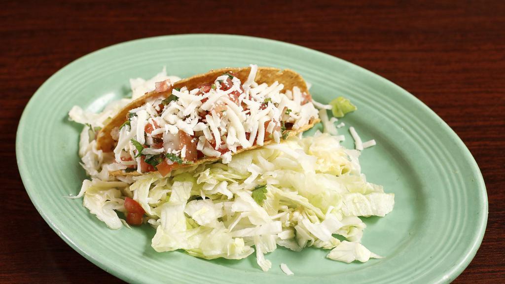 Crispy Taco · Your choice of meat, lettuce, cheese, pico de gallo, sour cream, and salsa.