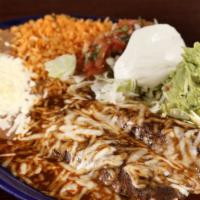 Mole Enchiladas · Two chicken enchiladas with rice and beans.