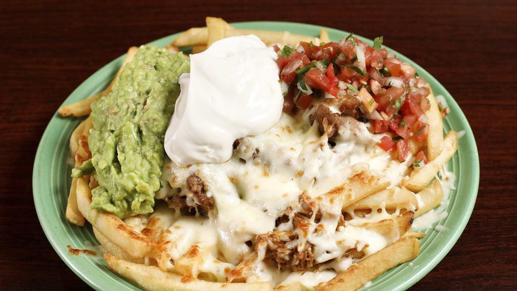 Cali Nachos · Your choice of meat, beans, sour cream, guacamole pico de gallo with French fries.