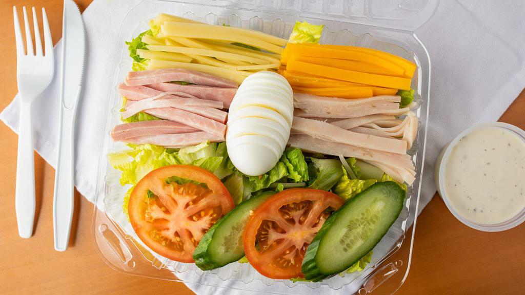 Chef Salad · Romaine lettuce, ham, turkey, egg, tomatoes, cucumber, cheddar and swiss cheeses.