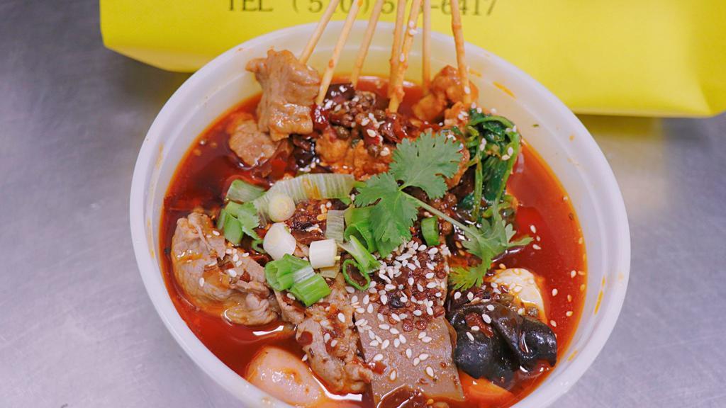 Mala Tang · All cooked food in mala tang style soup
included one choice of meat(beef or lamb) napa,shiitake mushroom,imtitation crab meat,squid ball,spam,taiwanese sausage,black funges,quail egg,vermicelli and come with one side of staple food.