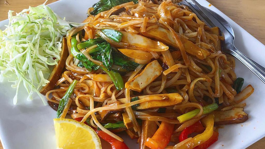 Spicy Noodle · Gluten free. Stir-fried rice noodles with red bell peppers, bean sprouts, onions, mushrooms, pea shoots, egg, garnished with crushed peanuts, cabbages and lemon wedge. Choice of: chicken, tofu, beef or shrimp for an additional charge.