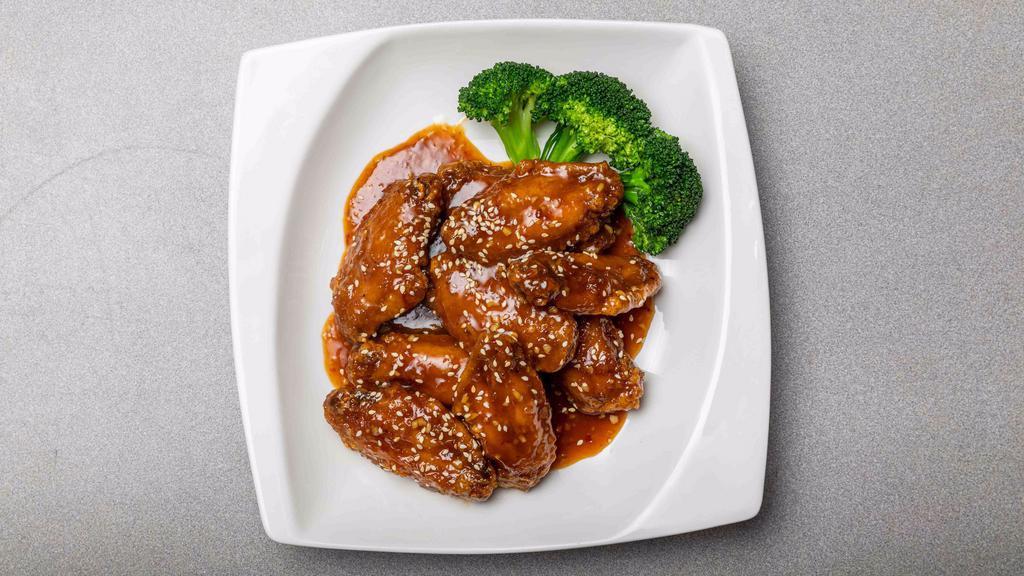 Honey Chicken Wings · Deep-fried chicken wings tossed with honey soy sauce, ginger, garlic and topped with green onions.