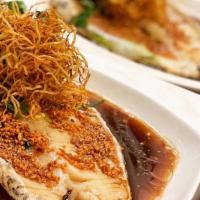 Ginger Chilean Sea Bass · Wild-caught Chilean sea bass with ginger, garlic, soy sauce and white wine.