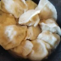 青岛鲅鱼饺Tsingtao Spanish Mackerel Dumplings · Stuffed dough.