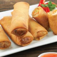 Fried Spring Rolls ปอทอด · Crispy spring rolls filled with vegetables and deep-fried to golden perfection served with p...