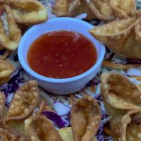 Crab Rangoon เกี้ยวปูทอด · Crab meat filled with cream cheese wrapped in wonton served with our secret sweet and sour s...