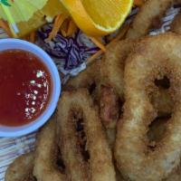 Fried Calamari ปลาหมึกทอด · Lightly battered calamari, breaded the deep fried and served with sweet and sour sauce.