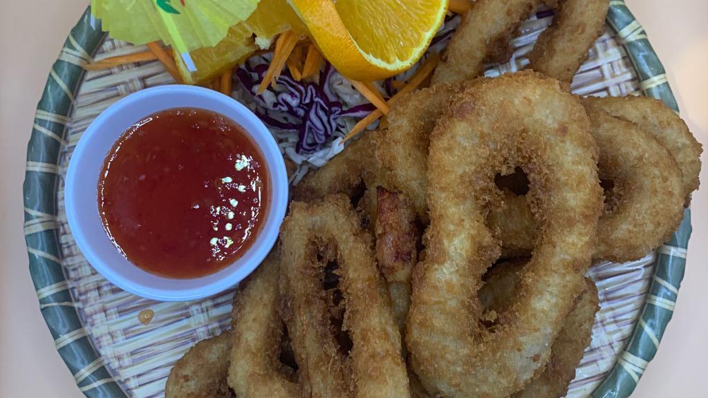 Fried Calamari ปลาหมึกทอด · Lightly battered calamari, breaded the deep fried and served with sweet and sour sauce.