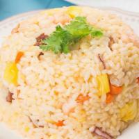 Pineapple Fried Rice ข้าวผัดสัปะรด · Fried rice with pineapple, egg, carrots, peas, onion, scallion, and cashew nuts.