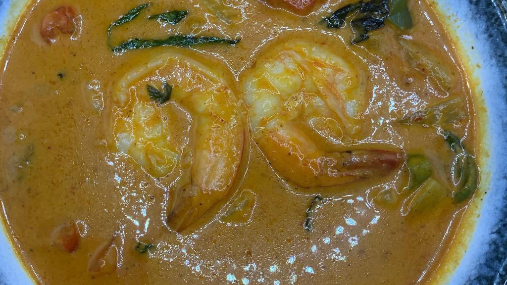 Pineapple Curry แกงคั่วสัปปะรด · A red spicy and savory coconut-milk based curry with pineapple, broccoli, bamboo shoats. zucchini and bell peppers.