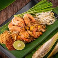Pad Thai ผัดไทย · Traditional stir-fried rice noodle dish with our authentic pad Thai sauce mixed with egg, to...