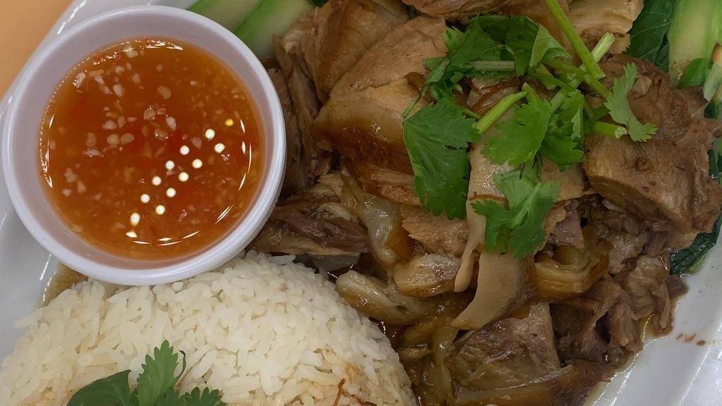 Khao Ka Moo ข้าวขาหมู · (Braised Pork Leg over rice) flavorful pork lag roast that is braised and then simmered for 3-4 hours in a broth made with star anise , cinnamon , cumin , sugar , soy sauces and side with egg , boiled Chinese broccoli .