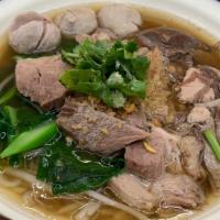 Stew pork Noodle soup ก๋วยเตี๋ยวหมูตุ๋น · slow cooked pork , bean sprout , Chinese broccoli , cilantro , Garlic , pork ball in thai st...