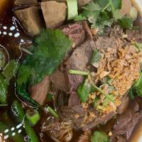 Stew beef Noodle soup ก๋วยเตี๋ยวเนื้อตุ๋น · Slow cooked beef , bean sprout , Chinese broccoli , cilantro , Garlic in thai style soup wit...