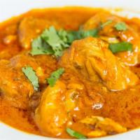 Chicken Curry · Medium. Chicken cooked in a blend of curry spices w/ tomato & onion.